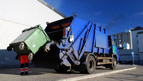 Construction site with organized waste clearance in Chessington