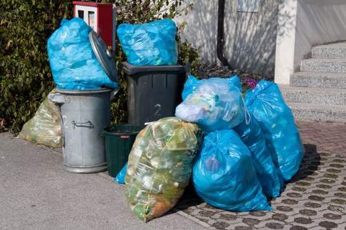 Waste removal service vehicles in Chessington